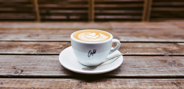 Cup of coffee and teaspoon, minimalist living